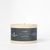 Candle with a label on a light gray background