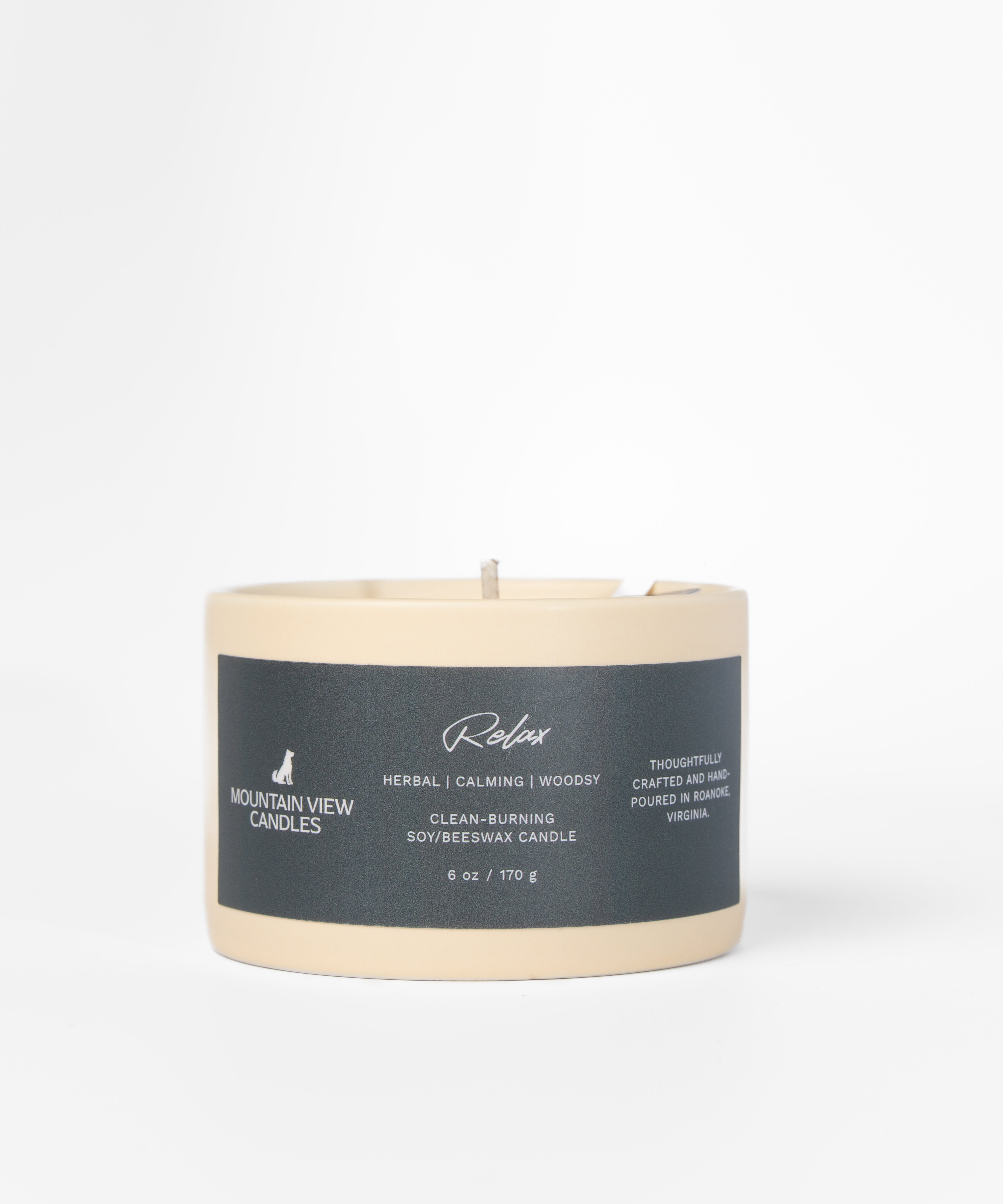 Candle with a label on a light gray background
