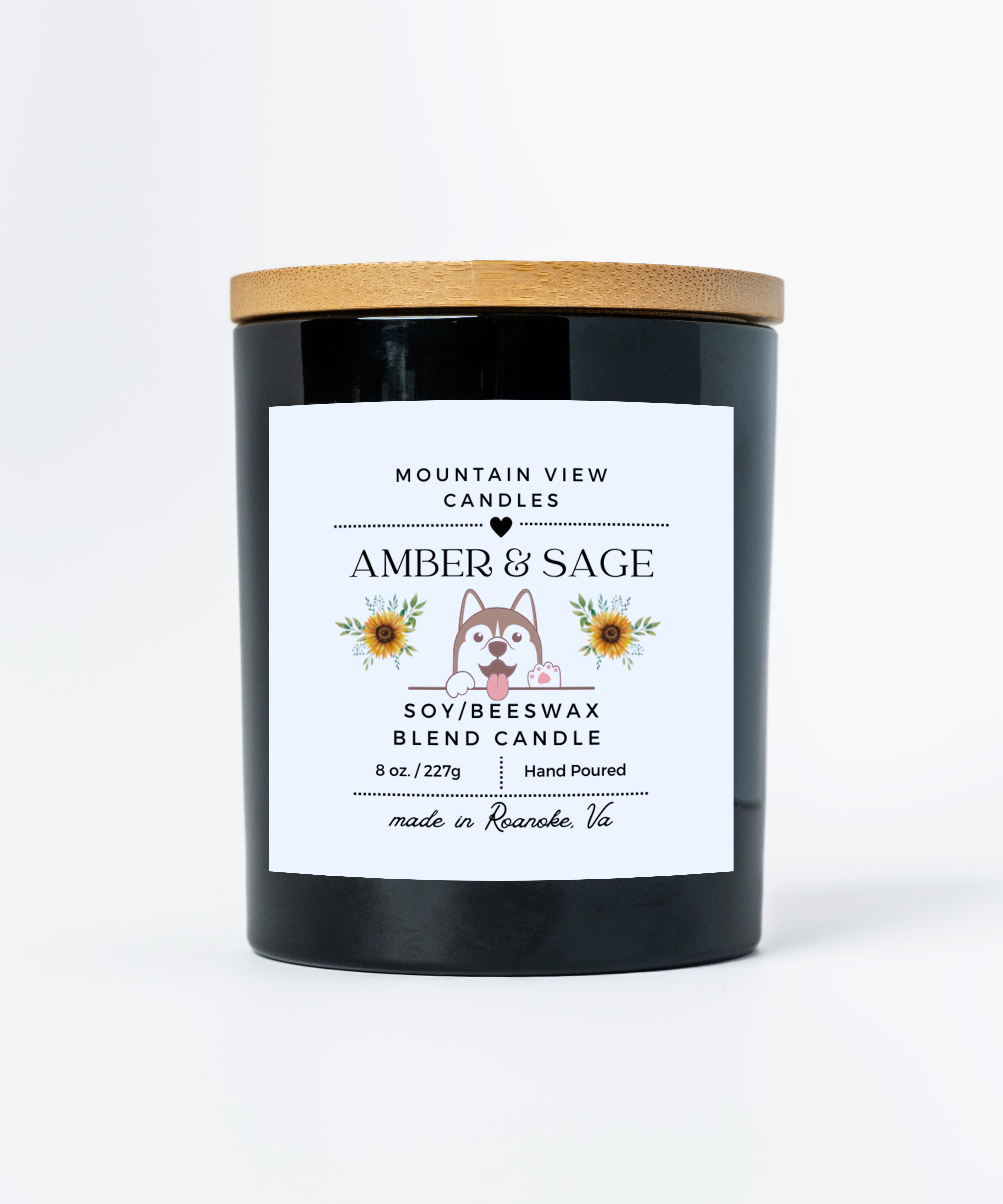 Black candle with a wooden lid and white label featuring branding and product details on a white background.