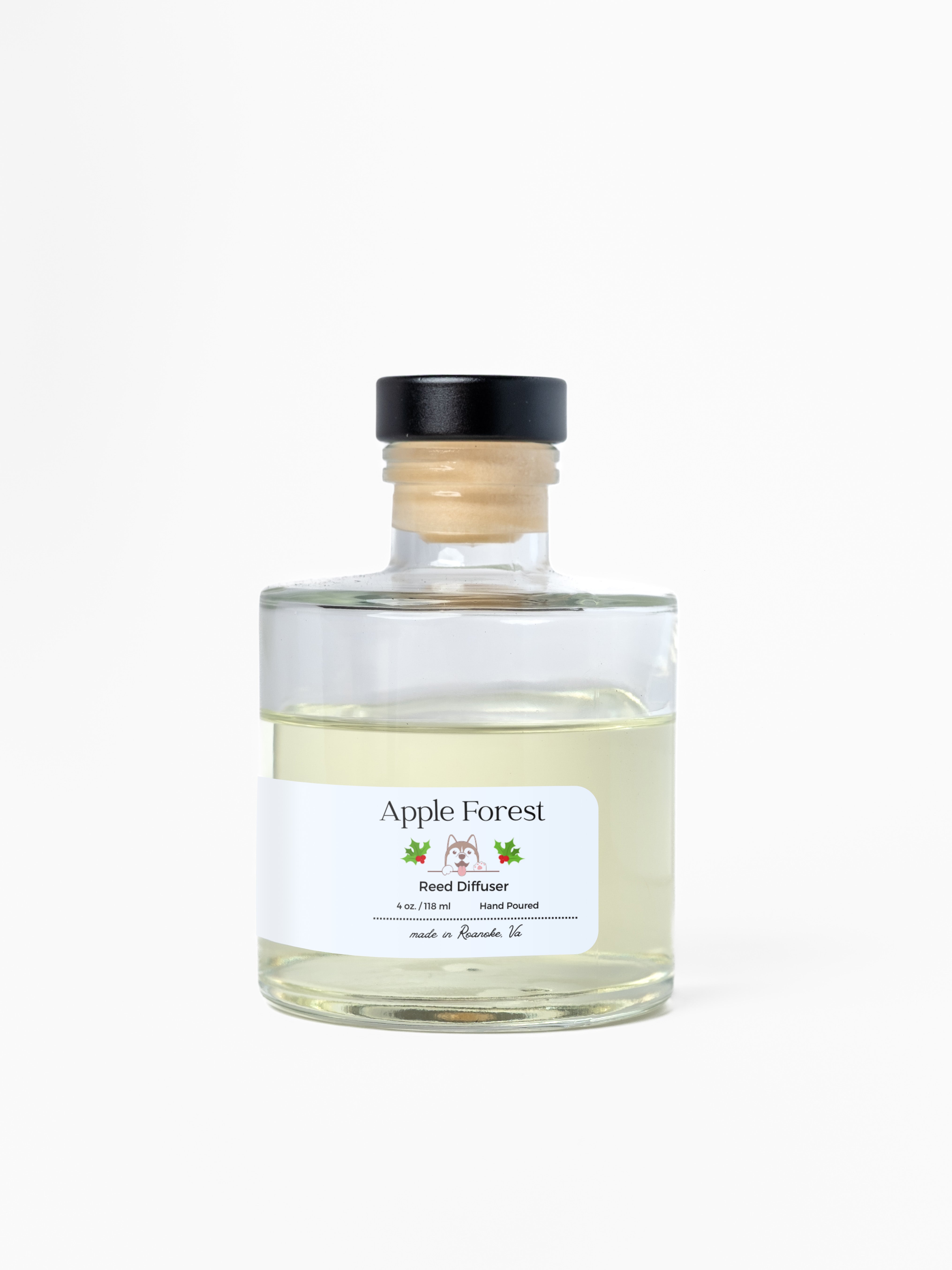 Clear glass bottle labeled 'Apple Forest' on a white background