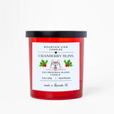 Cranberry Bliss candle with a red label on a white background