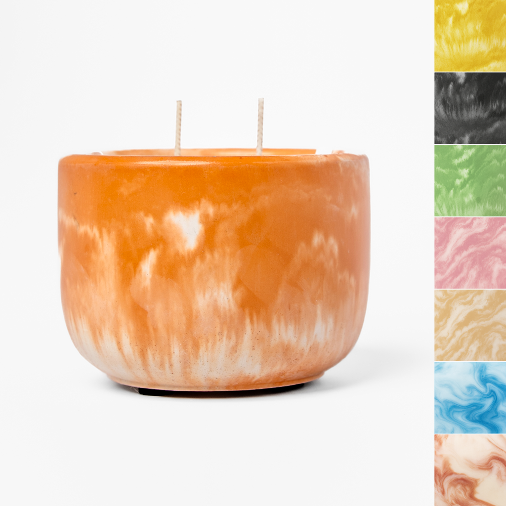 Marbled orange and white candle with color swatches on a white background