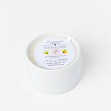 White candle with a label on a white background