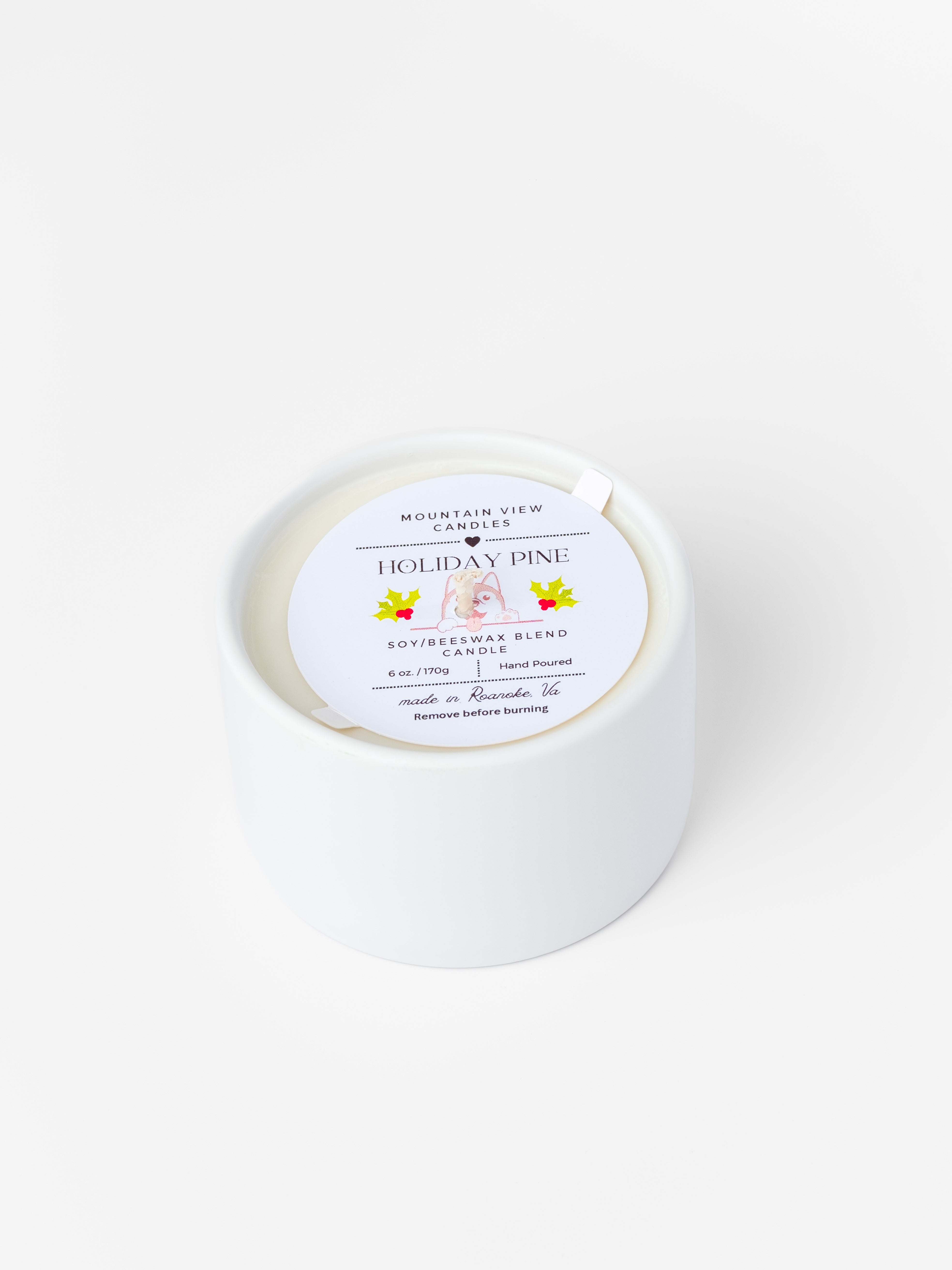 White candle with a label on a white background