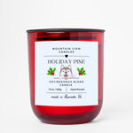 Red candle with a label on a white background