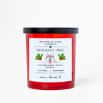 Red candle with a label on a white background