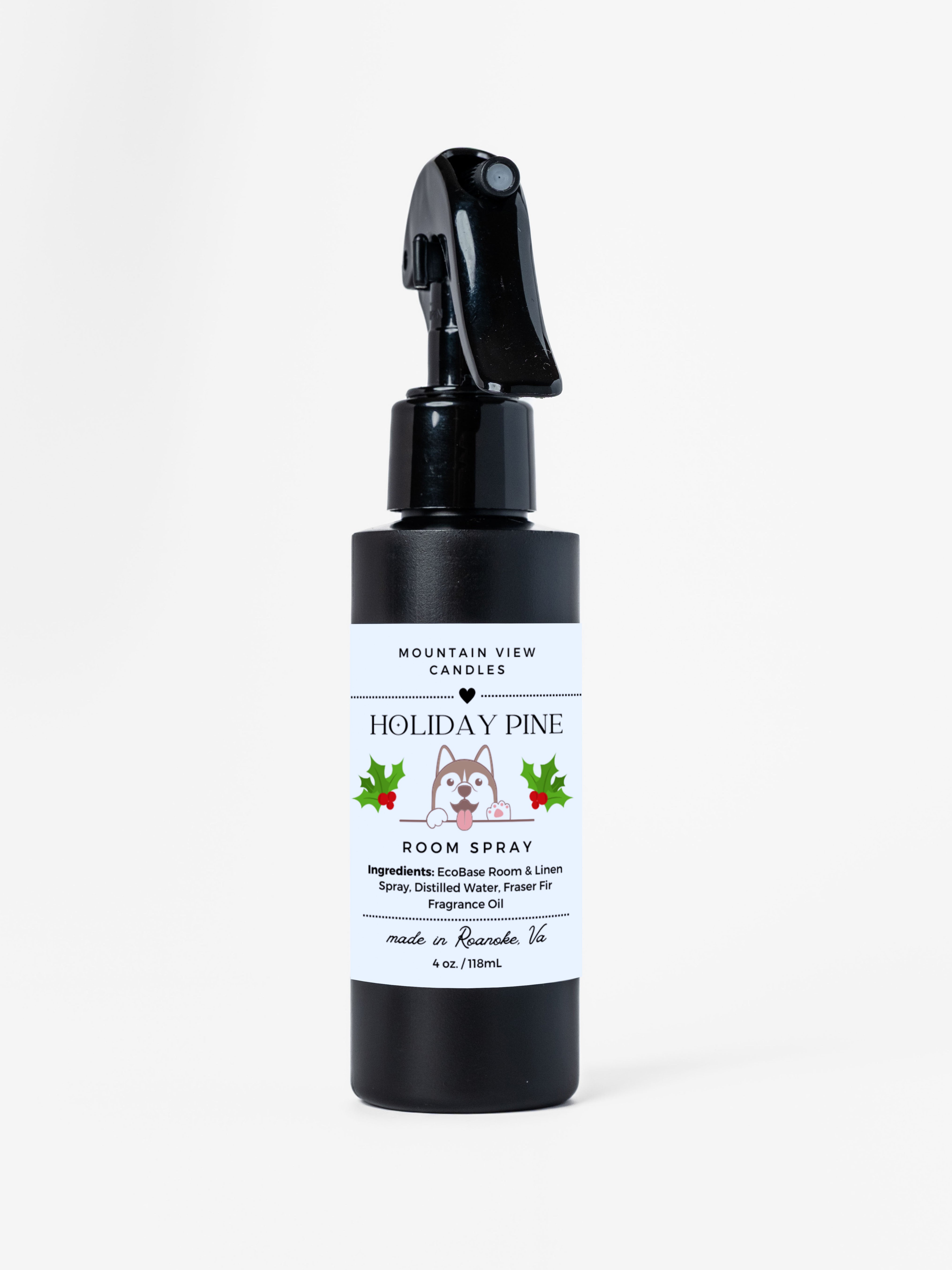 Black spray bottle labeled 'Holiday Pine' on a white background