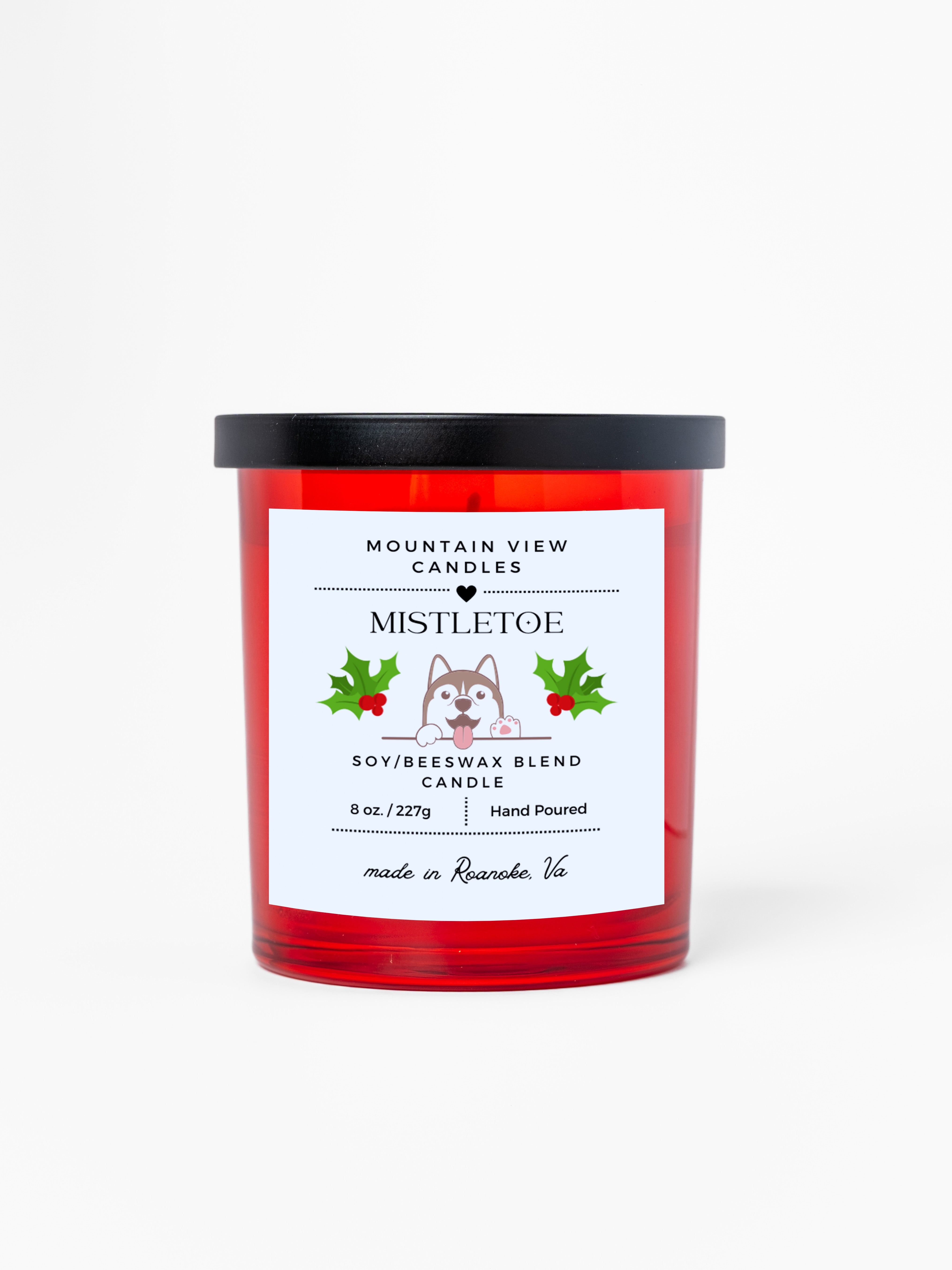Red candle with a white label featuring a dog illustration and text on a white background