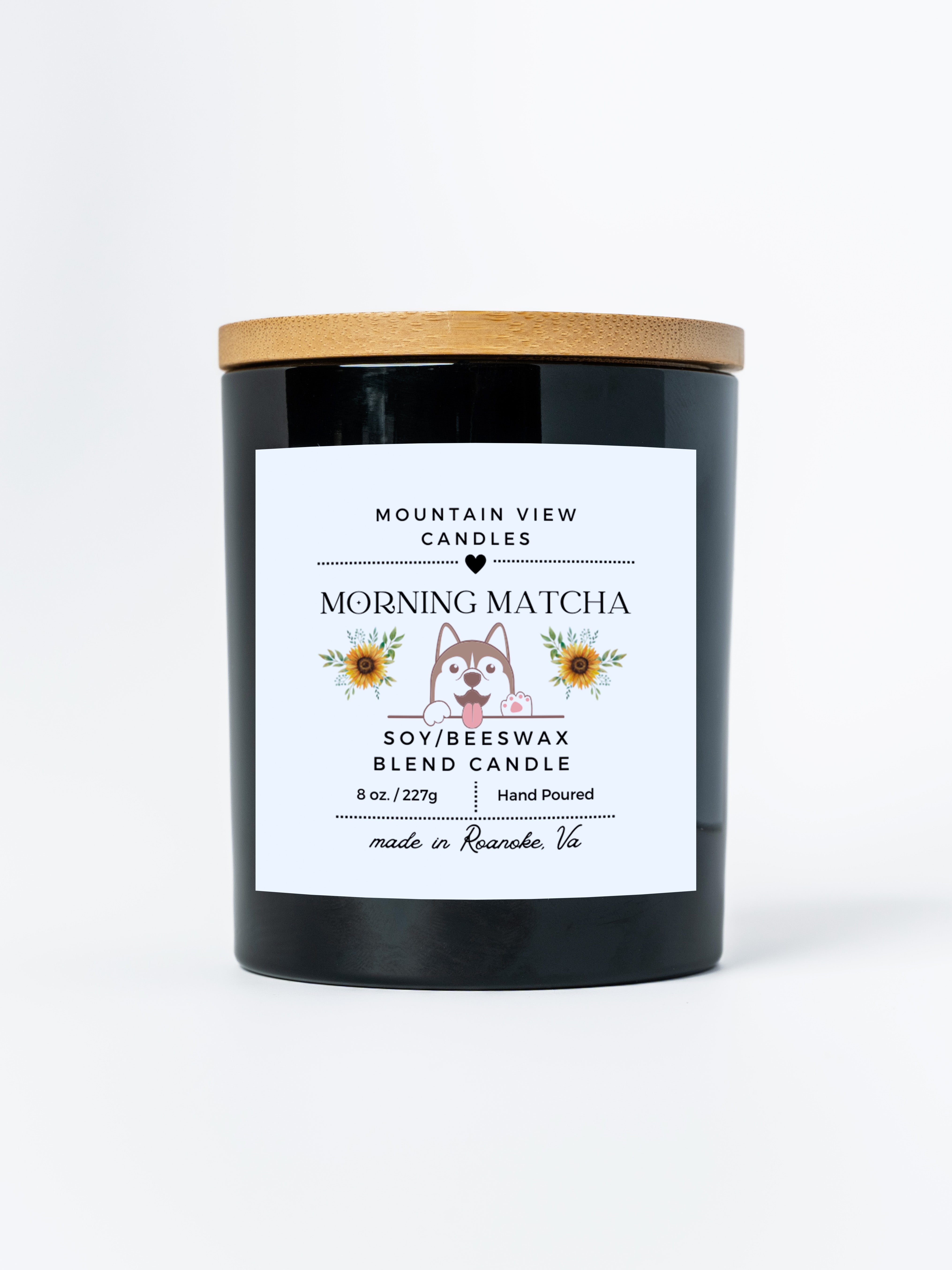 Black candle with a wooden lid and 'Mountain View Candles' label on a white background
