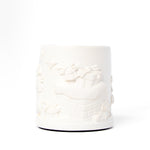 White textured candle on a white background