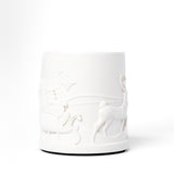 White ceramic vase with embossed design on a white background