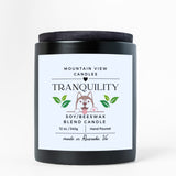 Candle with 'Tranquility' label on a white background